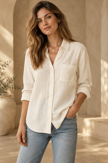 Woman wearing a warm ivory relaxed button-up top