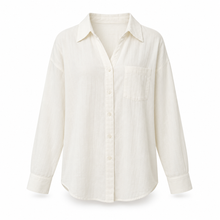 Warm ivory relaxed button-up top on a pure white background