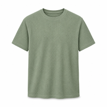 Muted sage textured waffle-knit T-shirt on a pure white background